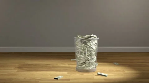 Stacks of 100 dollar bills are dumped into a trash can Stock Footage 42740967