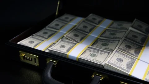 Stacks of 100 dollar bills in a briefcase , briefcase full of money . Stock Footage