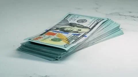 Stacks of 100 Dollar Bills on White Marble Surface Wealth Finance Concept 4K 스톡 동영상 334849735