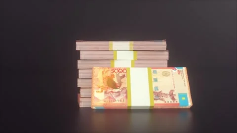 Stacks of 5000 Kazakh Tenge Banknotes on Dark Glossy Surface Stock Footage 316627128