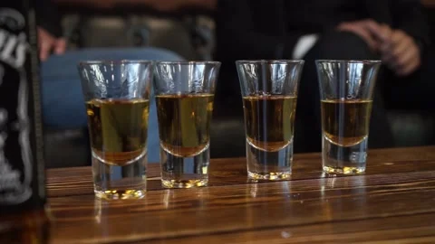 Stacks of alcohol on the table Stock Footage 159896730