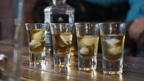 Stacks of alcohol on the table Stock Footage 159896962