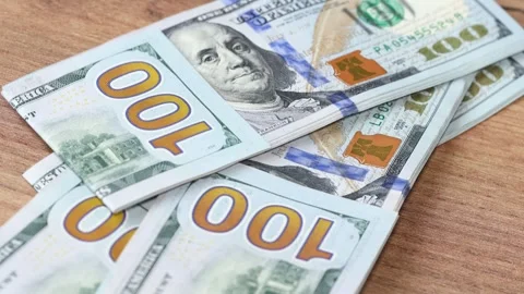 Stacks of American dollars thrown on the table, 100 dollar banknotes Stock Footage 264964552