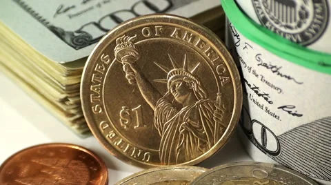 Stacks and bundles of dollar banknotes and euro coins Stock Footage 67829786
