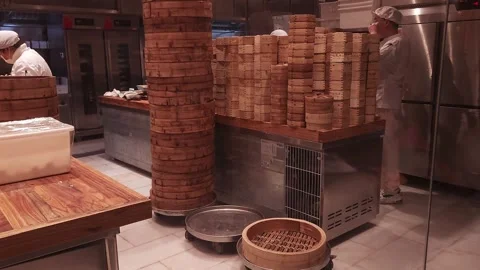 Stacks of bamboo steaming racks in a restaurant, 4K Video stock 264308840