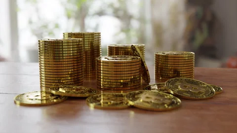 Stacks of bitcoins on the table Stock Footage 253589734