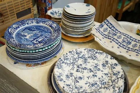 Stacks of blue and white pattern porcelain ceramic plates and pottery dishes Stock Photos