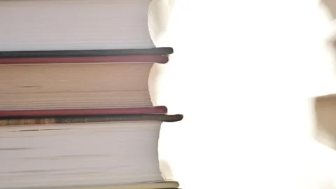 Stacks of books in rays of light. The light of knowledge. Stock Footage 333328921