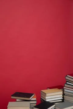 Stacks of books to study in the red library of the university Foto stock