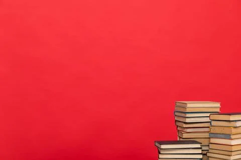 Stacks of books to study in the red library of the university Foto stock