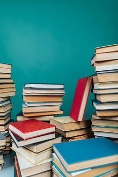 Stacks of books for teaching knowledge college library green background 스톡 사진