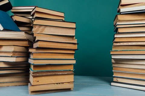 Stacks of books for teaching knowledge of the university library green Stock Photos