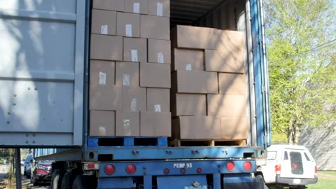Stacks of boxed up food donations in the back of a semi-truck Stock-Footage 131000812