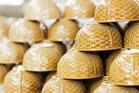 Stacks of brown cups in warehouse Stock Photos