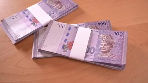 Stacks of cash drop onto the table Stock Footage 292759215