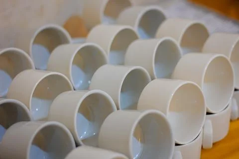 Stacks of Ceramic Cups Arranged Neatly with Soft Natural Light Showing Inner  Stock Photos