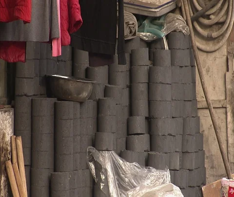 Stacks of coal ash bricks in village Stock Footage 86745314