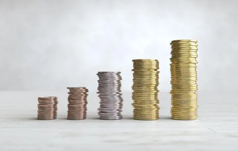 Stacks of coins arranged in a bar graph, Saving money concept Stock Photos