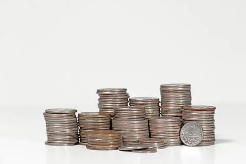 Stacks of coins close-up on a white background, Financial crisis Stock Photos