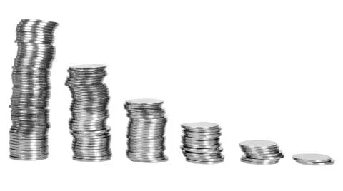 Stacks of coins in decreasing order Stockfoto's