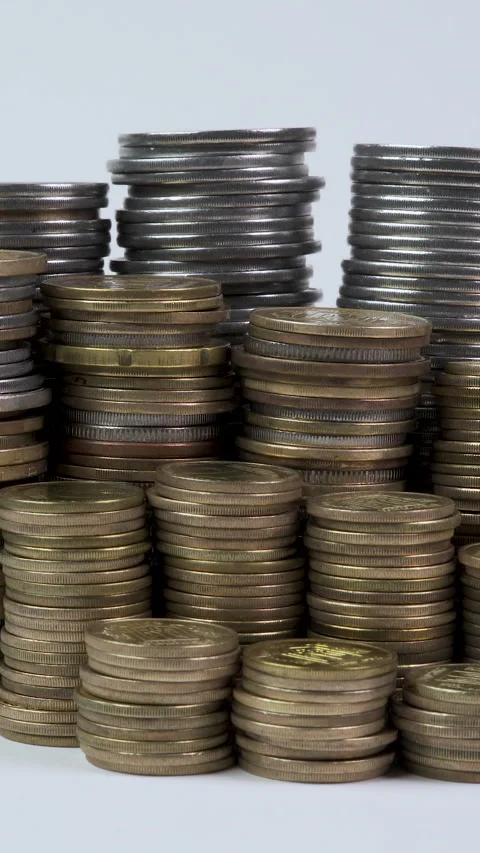 Stacks of coins of different denominations Stock Footage 288319295