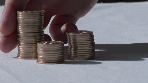 Stacks of coins falling over. Stock Footage 145236702
