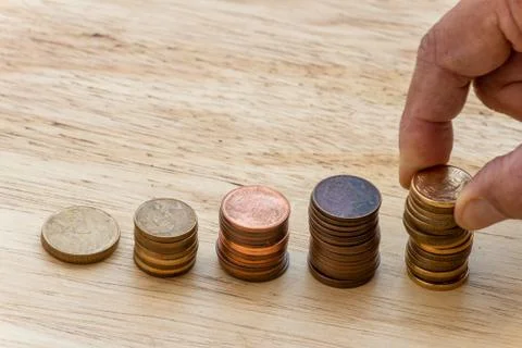 Stacks of coins forming a graph. Stock-Fotos