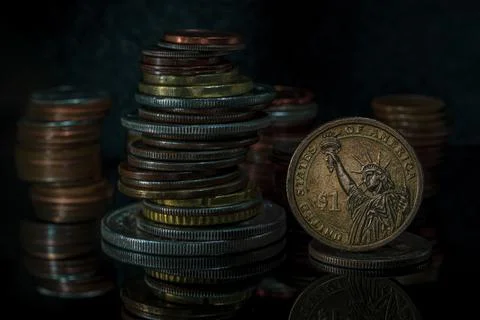 Stacks of Coins One Dollar Coin Blurred Background Dramatic Light Macro Stock Photos