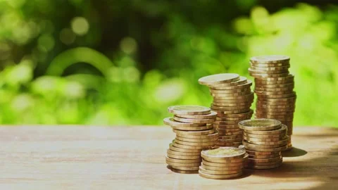 Stacks of coins represent wealth and wealth management. Money coin stack growing Stock Footage 232205684