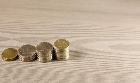 Stacks of coins in shape of ladder Stock Photos