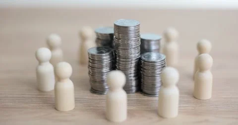 Stacks of coins surrounded by human figures Stock Footage 240422076