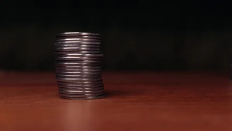 Stacks of coins on the table Stock Footage 123135454