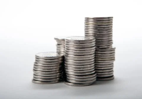 Stacks of coins on a white background Stock Photos