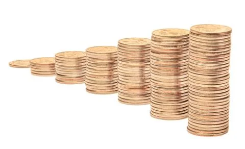 Stacks of coins on a white background. Stock Photos