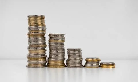 Stacks of coins on a white background Stock Photos