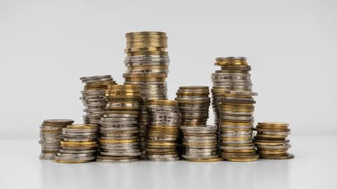 Stacks of coins on a white background Stock Photos