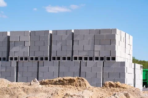 Stacks of concrete blocks on pallets at a construction material wearhouse rea Stock Photos