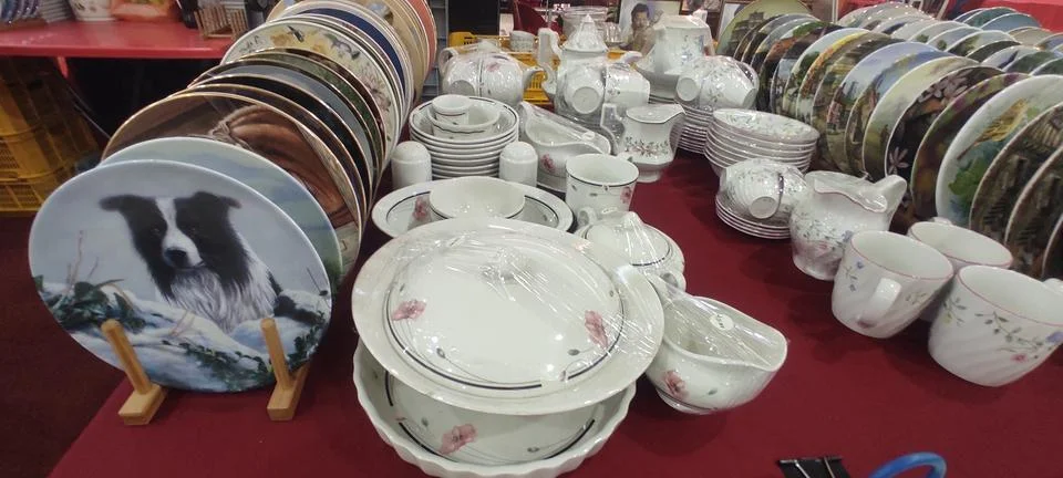 Stacks of Decorative Plates &amp; Dinnerware Sets Stock Photos