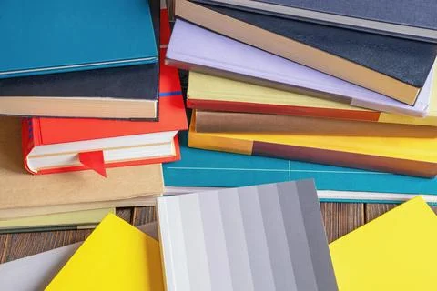 Stacks of different books on table. Knowledge concept Stock Photos