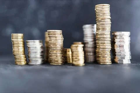 Stacks of different golden and silver coins creating a big amount of savings, Stock Photos