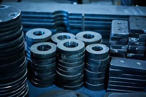 Stacks of different shape workpieces for detail making Stockfoto's