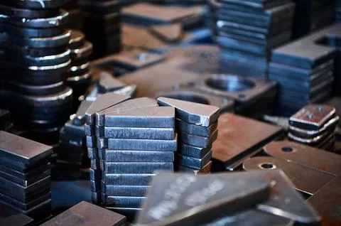 Stacks of different shape workpieces for detail making Stockfoto's