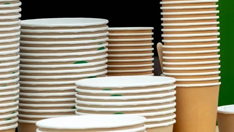Stacks of disposable paper cups in various sizes Stock Footage 348237682