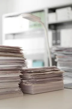 Stacks of documents on desk in office. Space for text Stock Photos