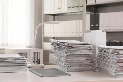 Stacks of documents on table in office Stock Photos