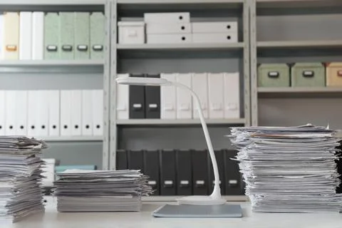 Stacks of documents on table in office Stock Photos