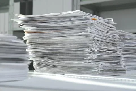 Stacks of documents on table in office Stock Photos
