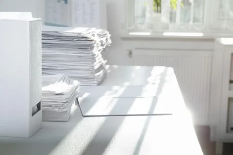 Stacks of documents on table in office Stock Photos