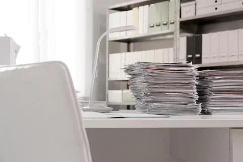 Stacks of documents on table in office Stock Photos