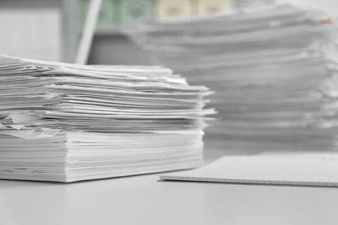 Stacks of documents on table in office Stock Photos